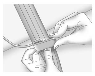 3. Place the guide over the belt, and insert the two edges of the belt into the