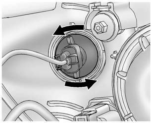 2. Remove the parking/turn signal lamp bulb socket from the headlamp assembly