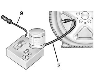 7. Attach the sealant/air hose (2) to the tire valve stem by turning it clockwise