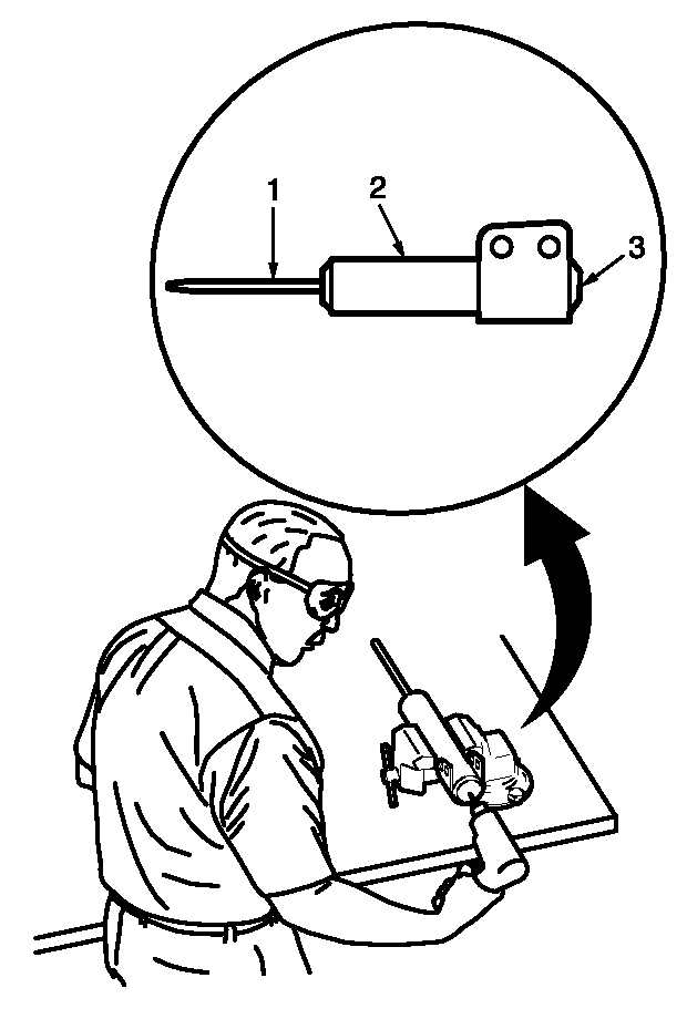 Clamp the strut in a vise horizontally with the rod (1) completely extended.