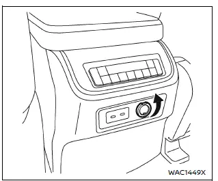 Nissan Armada power outlet with lid open ready for accessory connection