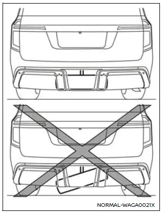 Nissan Armada spare tire properly aligned with hanging plate for storage