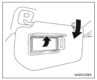 Nissan Armada vanity mirror sun visor with cover opened